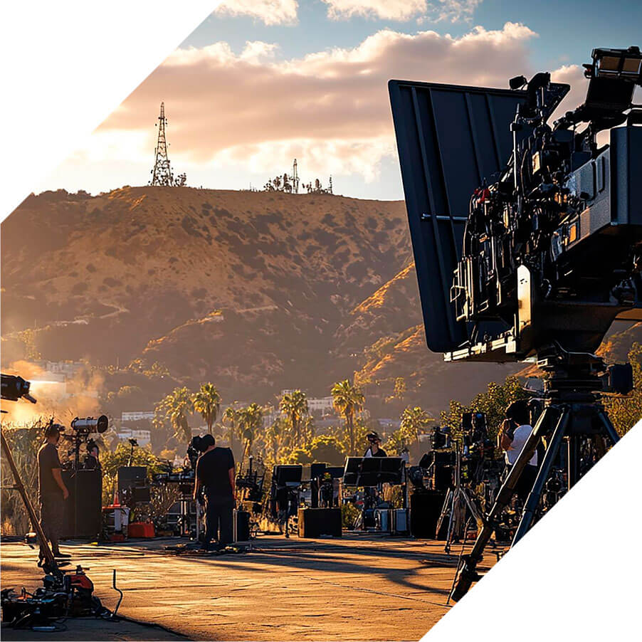 A camera on a tripod is poised to take a picture of a breathtaking mountain scene.
